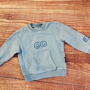 Loud blue-green sweatshirt with eyes embroidery sz